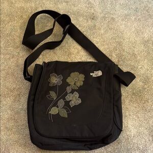 The North Face Black Messenger Bag with Floral Design